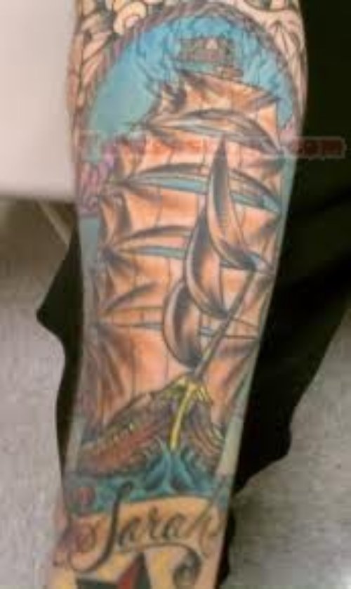 Ship Tattoo On Full Arm