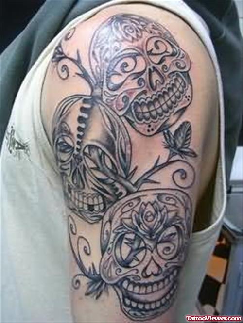 Flowers And Skull Tattoo On Shoulder