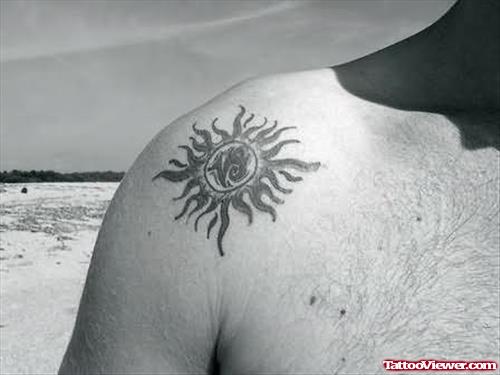 Sun Tattoo On Upper Shoulder