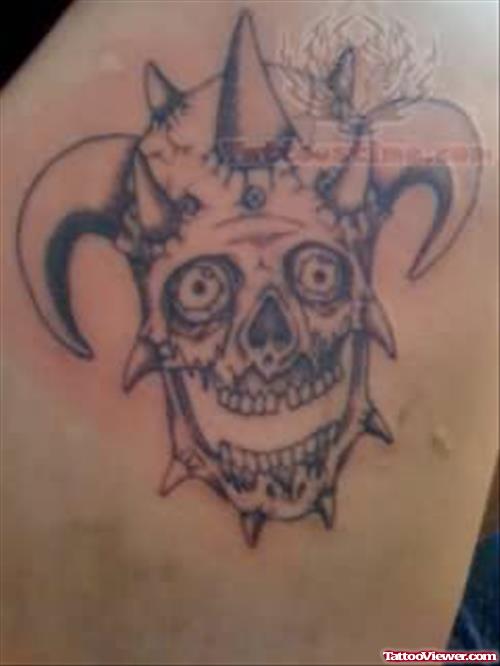 Grey Ink Joker Skull Tattoo