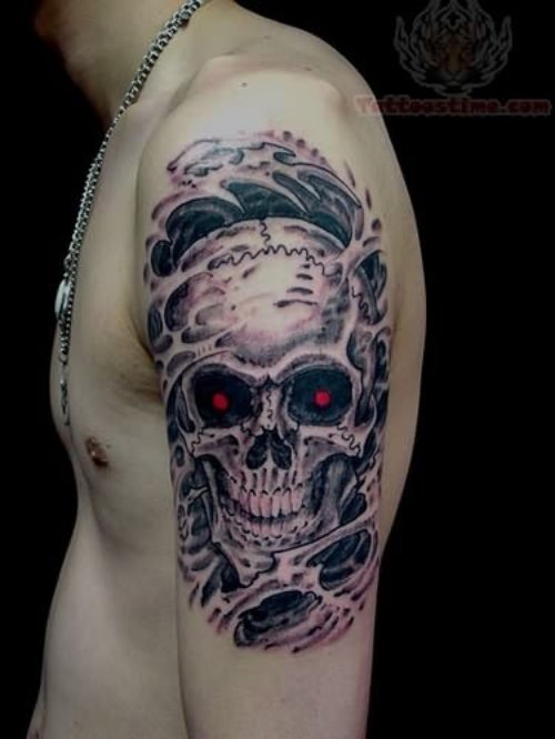 Red Eyes Skull Tattoo On Shoulder