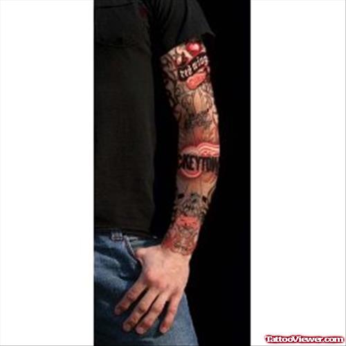 Man With Colored Left Sleeve Tattoo