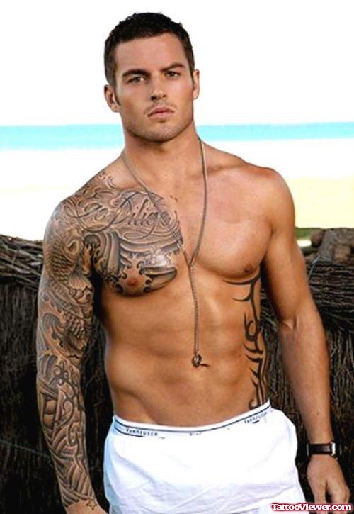 Grey Ink Chest And Sleeve Tattoo For Men
