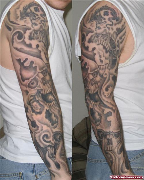 Dragon And Grey Skulls Sleeve Tattoo