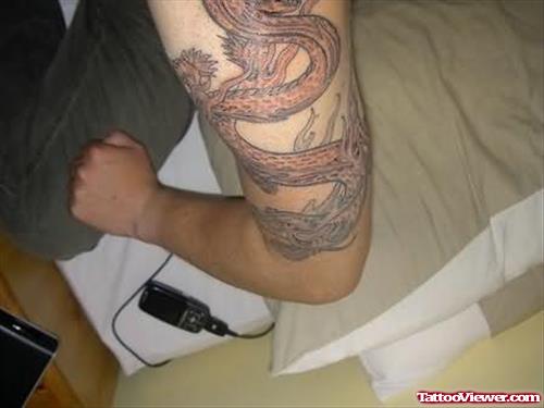 Snake Tattoo On Upper Shoulder