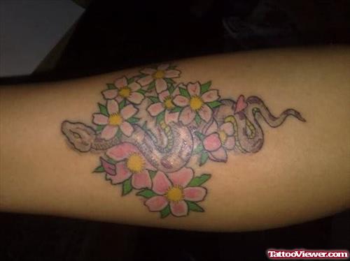 Snake In Flowers Tattoo On Arm