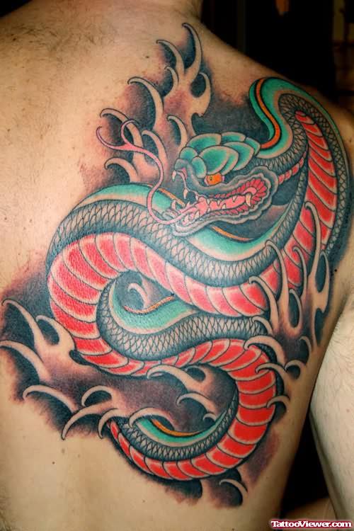 Blue And Red Ink Tattoo On Back