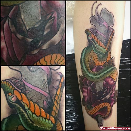 Snake on flower tattoo