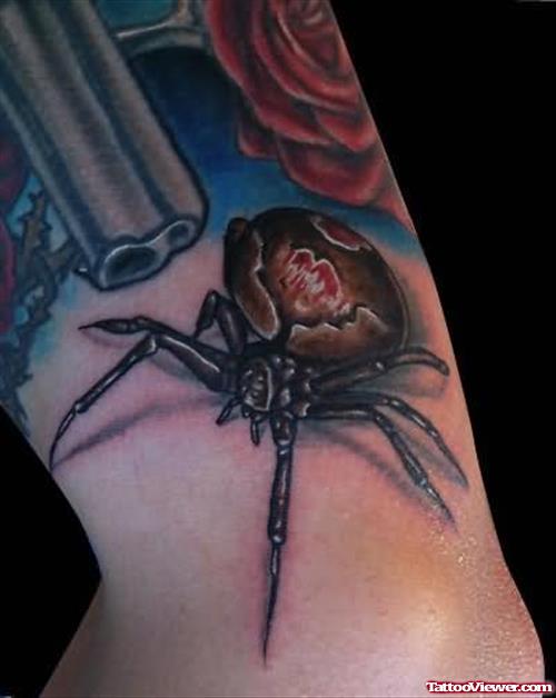 Gun And Spider Tattoo On Arm