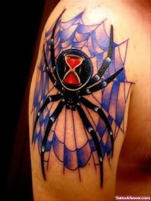 Blue Coloured Spider Tattoo On Shoulder