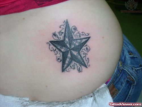 Black Ink Star Tattoo On Hip