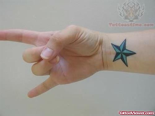 Blue Star Tattoo On Wrist