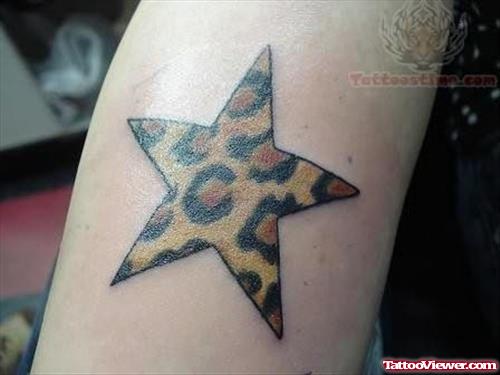 Spoted Star Tattoo On Arm