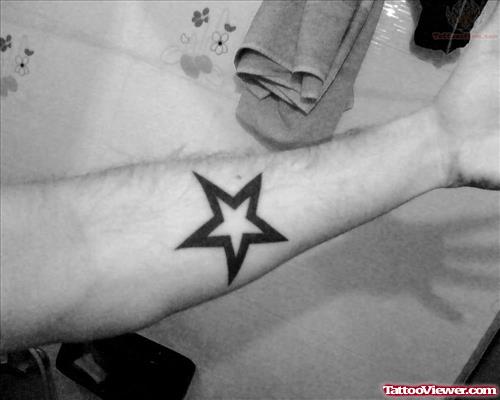 Black Bold Star Tattoo On Arm