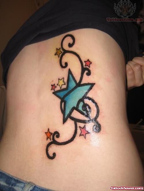 Small Star Tattoo On Rib
