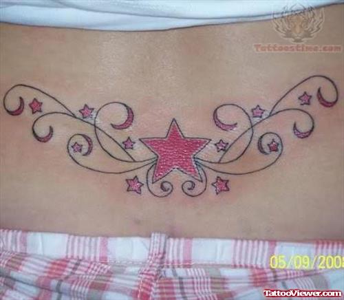 Pink ink Star Tattoo On Lower Back