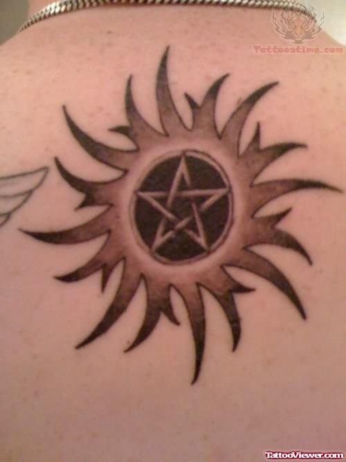 Sun And Star Tattoo On Back