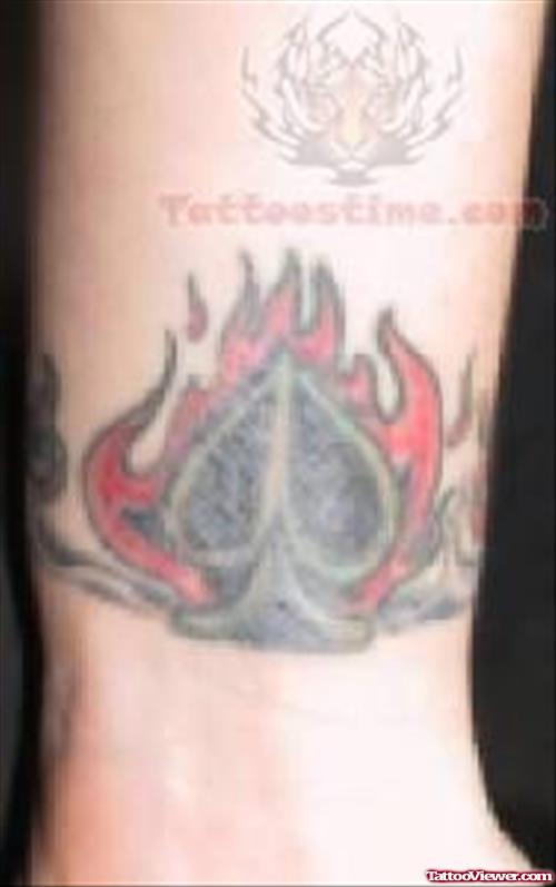 Red Firing Symbol Tattoo On Arm
