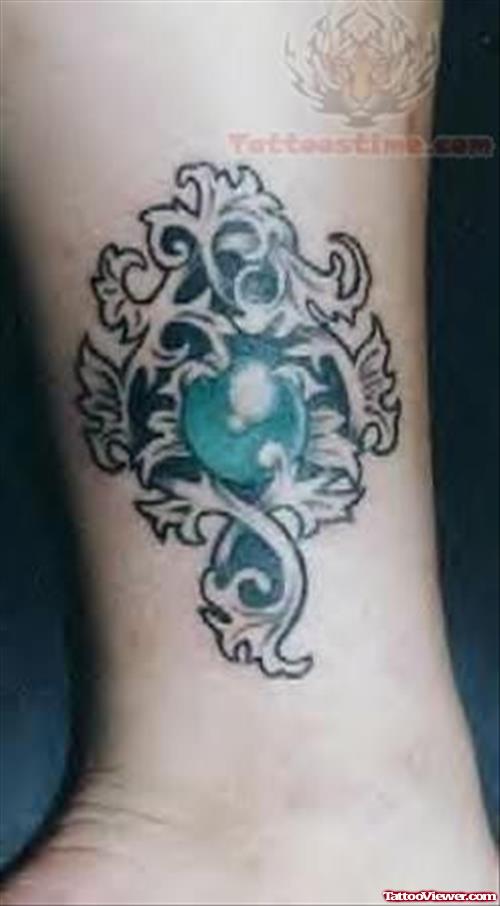Green Well Designed Symbol Tattoo