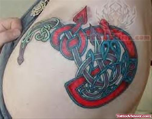 Colourful Symbol Tattoo On Shoulder