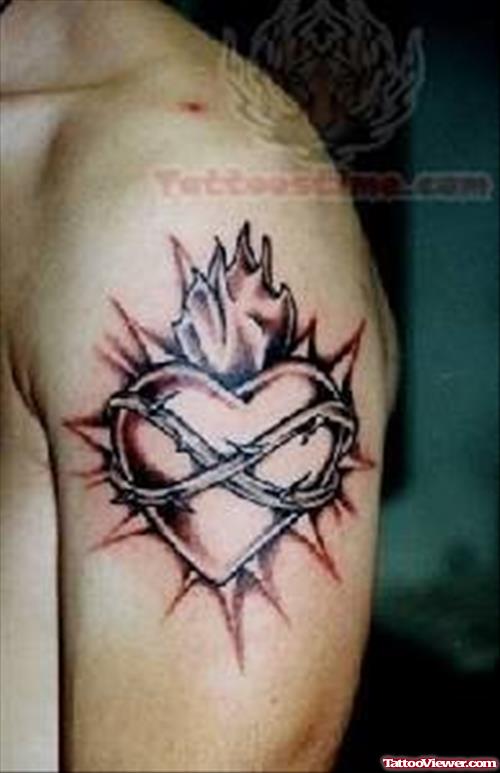 Heart Symbol Tattoo On Biceps