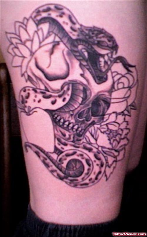 Skull Lotus And Snake Thigh Tattoo
