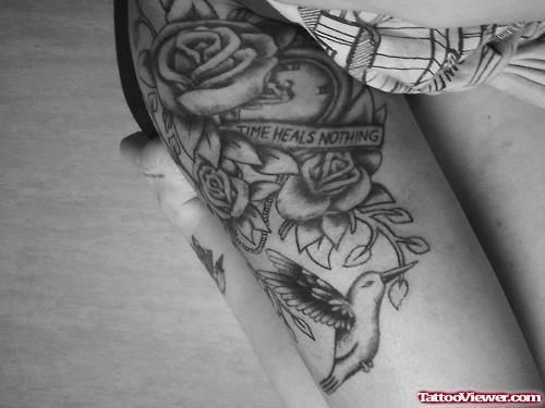 Grey Rose Flowers And Flying Hummingbird Thigh Tattoo