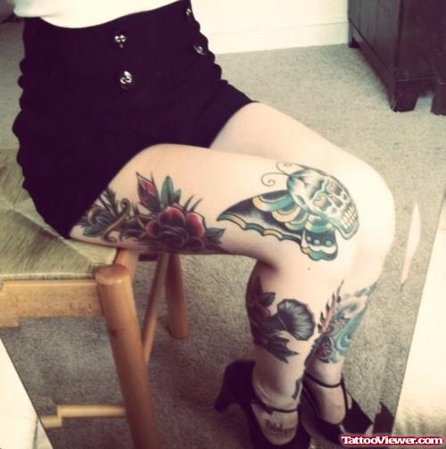 Red Rose and Butterfly Winged Skull Tattoo On Thigh