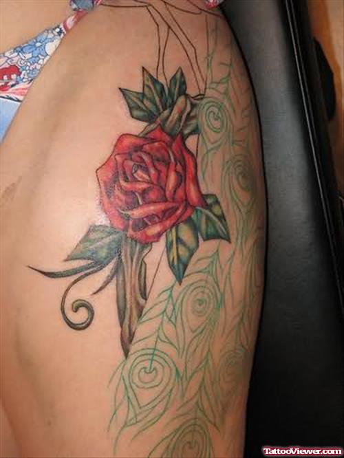 Red Rose And Peacock Feathers Tattoo On Left Thigh