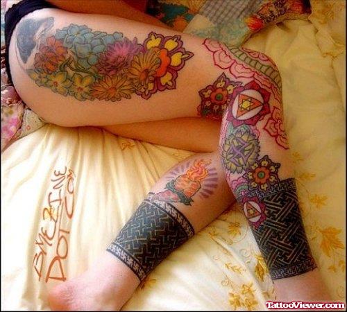 Amazing Colored Flowers Tattoos On Thigh