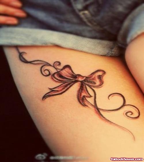 Small Bow Thigh Tattoo