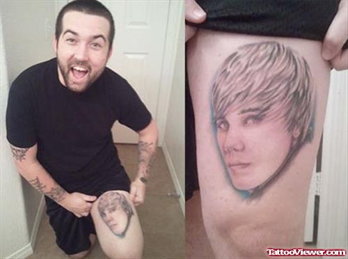 Grey Ink Boy Head Tattoo On Thigh