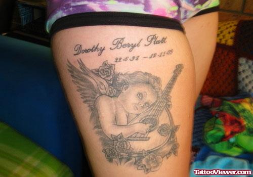 Memorial Cherub Angel With Guitar Thigh Tattoo