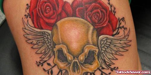 Red Roses And Winged Skull Thigh Tattoo