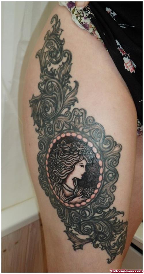 Girl Head In Frame Tattoo On Right Thigh