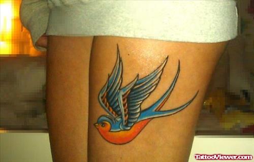Colored Swallow Tattoo On Left Thigh