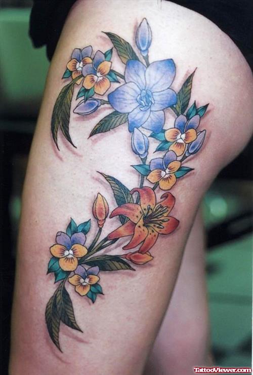 Blue and Red Flowers Tattoos On Left Thigh