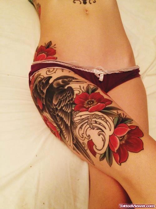 Awesome Red Flowers And Crow Thigh Tattoo