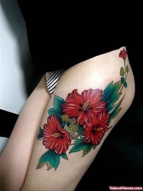 Red Flowers Tattoo On Thigh