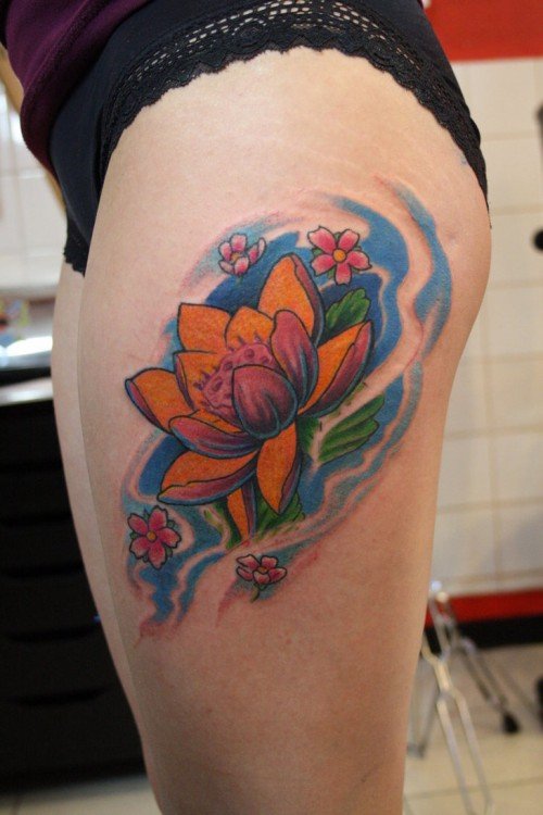 Colored Lotus Flower And Thigh Tattoo