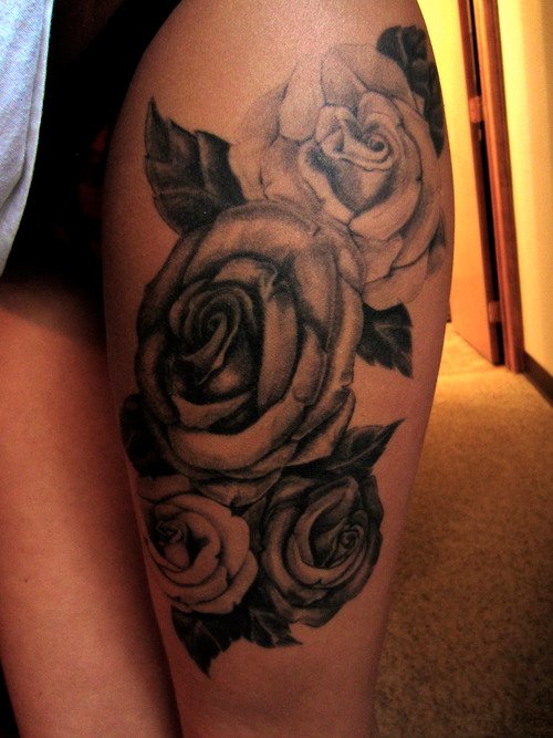 Awesome Grey Rose Flowers Tattoo On Left Thigh
