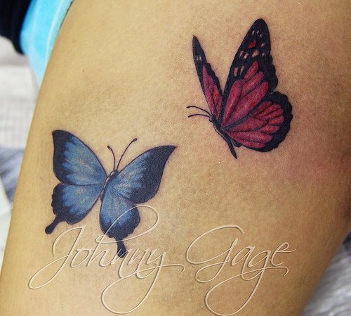 Blue And Red Butterfly Thigh Tattoos