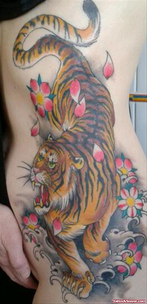 Color Flowers And Tiger Tattoo On Side Rib