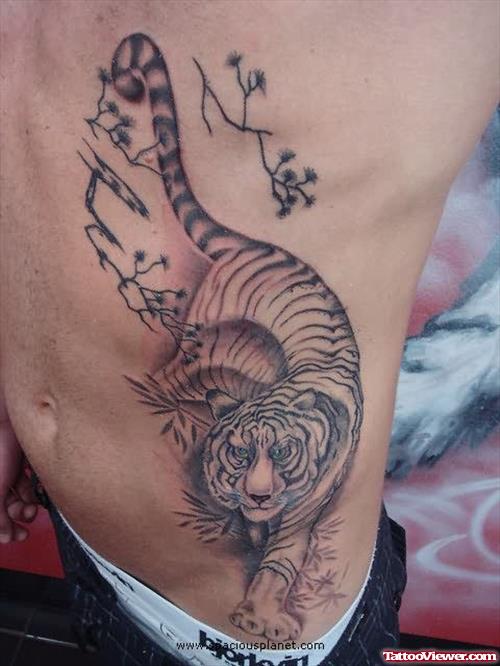 Grey Ink Tiger Tattoo On Left Rib