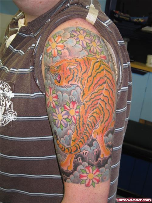 Colored Japanese Tiger Tattoo On Left Half Sleeve