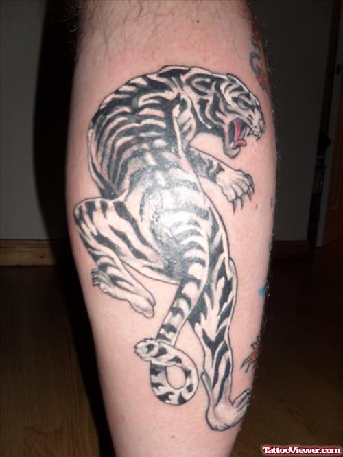 Grey Ink Tiger Tattoo On Back Leg