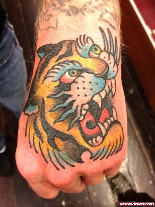 Colored Ink Tiger Head Tattoo On Left Hand