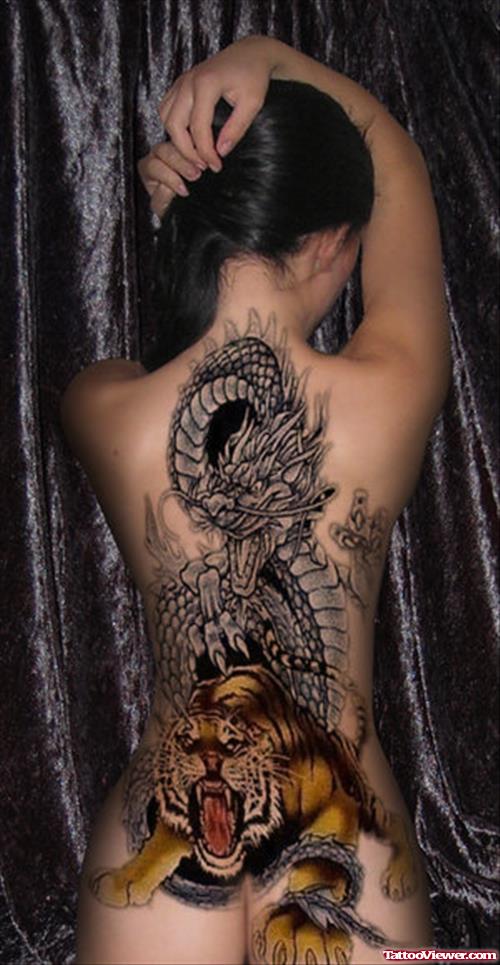 Grey Ink Dragon And Tiger Tattoo On Back