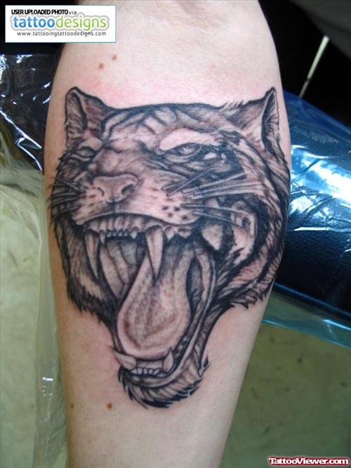Grey Ink Tiger Head Tattoo On Leg