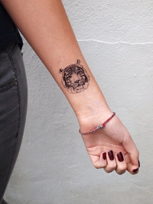 Girl left Arm Tiger Head Tattoo